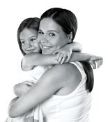 mom holding child both smiling